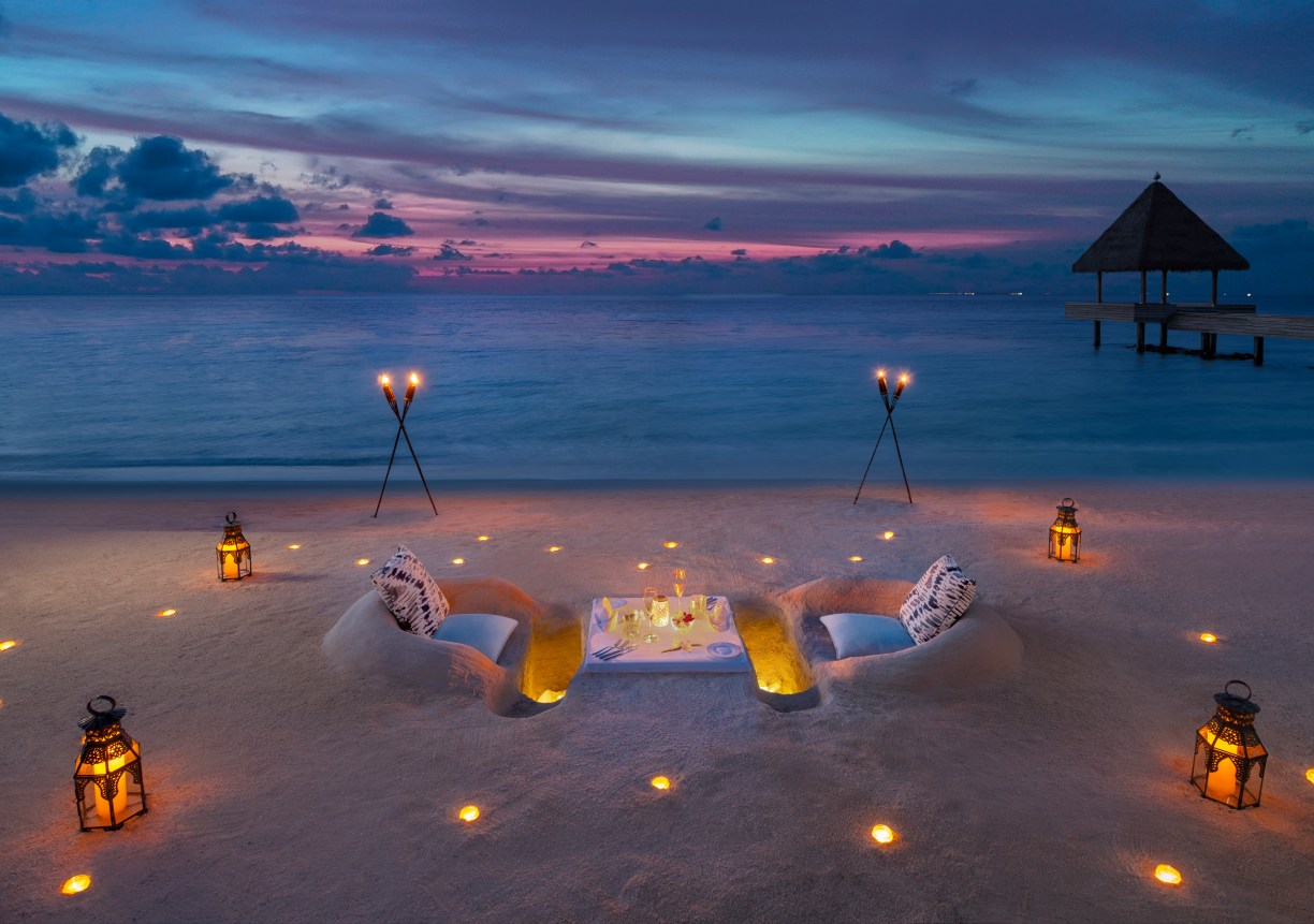 beach sand dinner sunset hotel Waldorf Astoria Maldives Ithaafushi