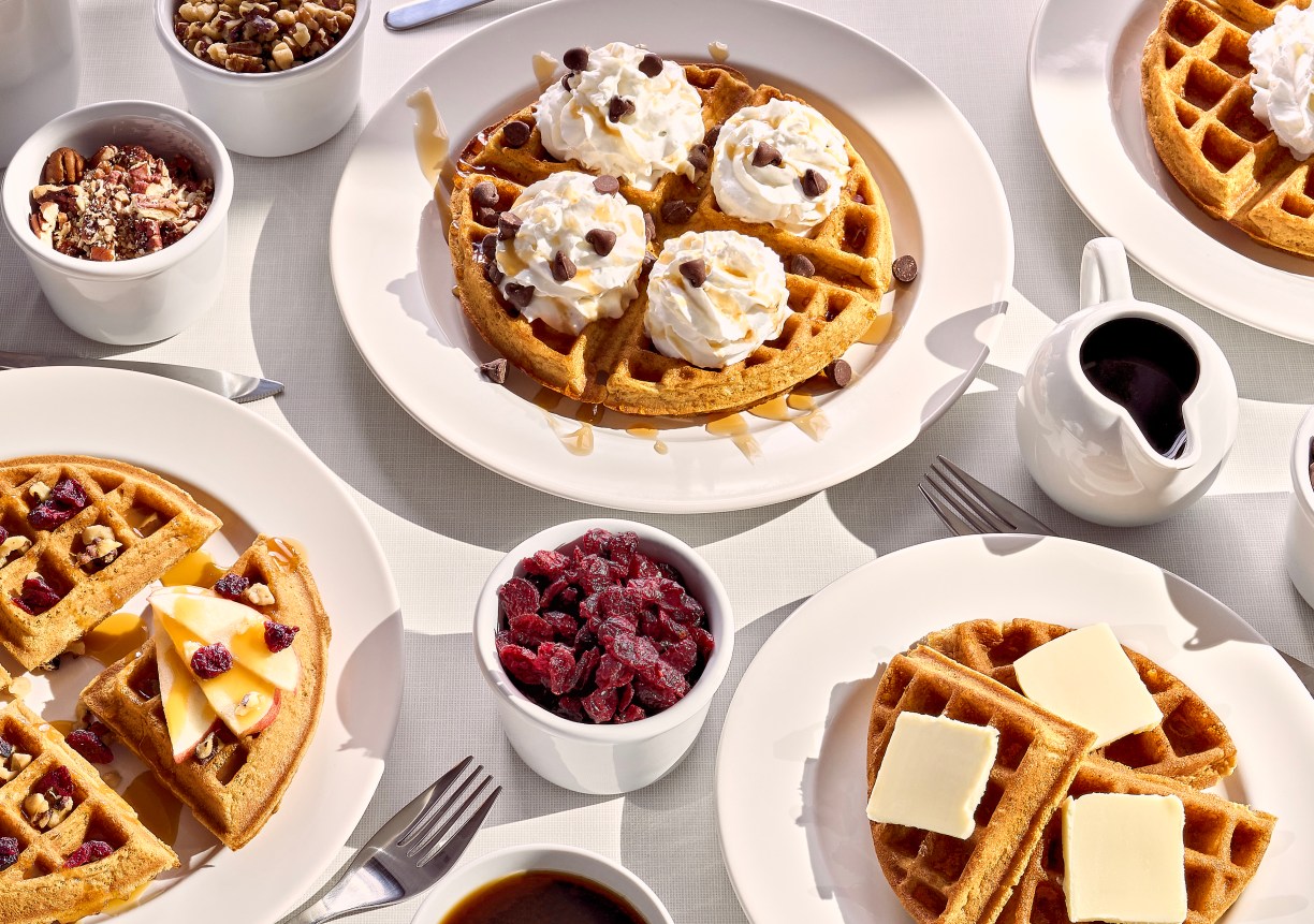 table with pumpkin spice waffles and toppings, Hampton by Hilton