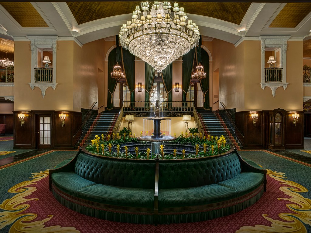 lobby seating and chandelier Amway Grand Plaza, Curio Collection by Hilton Lobby