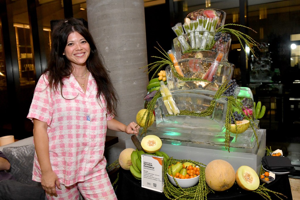 Natasha Pickowicz serves fruit pops to attendees at an exclusive Hilton Honors event with Questlove at Motto by Hilton New York City Chelsea