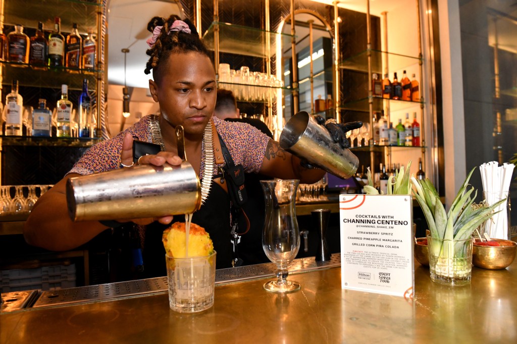 Channing Centeno pours creative cocktails at an exclusive Hilton Honors event with Questlove at Motto by Hilton New York City Chelsea