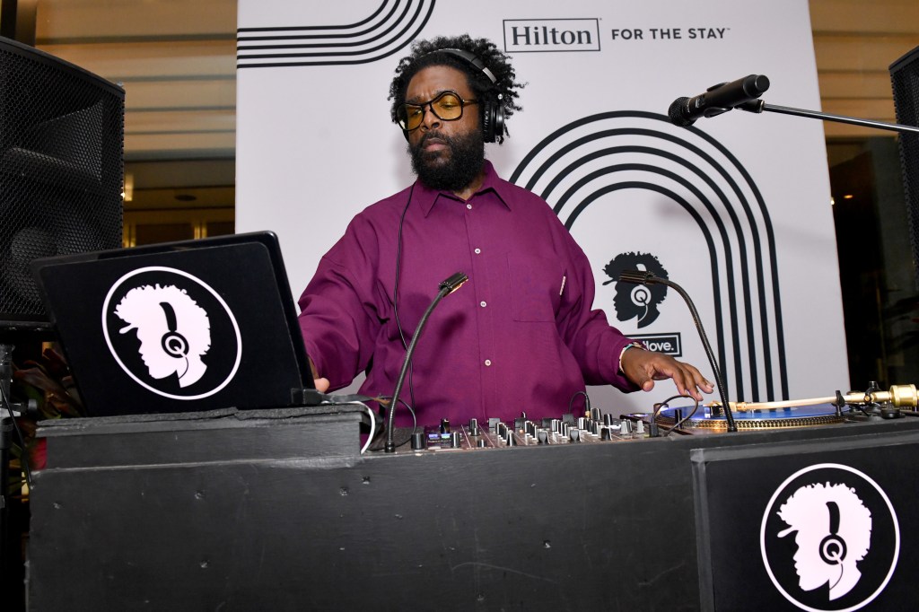 Questlove spinning in the DJ booth at an exclusive Hilton Honors event at Motto by Hilton New York City Chelsea