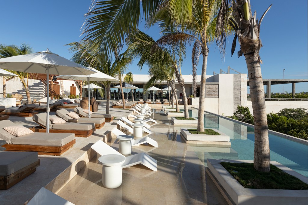 infinity pool and lounge area, Motto by Hilton Tulum
