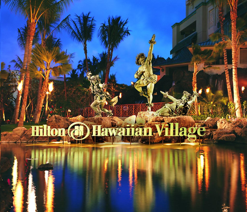Hilton Hawaiian Village Waikiki Beach Resort exterior - sign and water