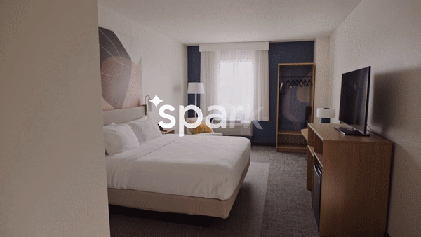 Spark by Hilton Animated Gif of guest room hotel bed and adjustable desk