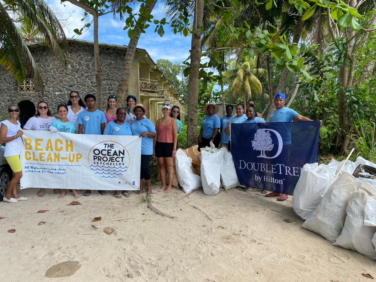 DoubleTree by Hilton - Clean Up Group Photo on the beach