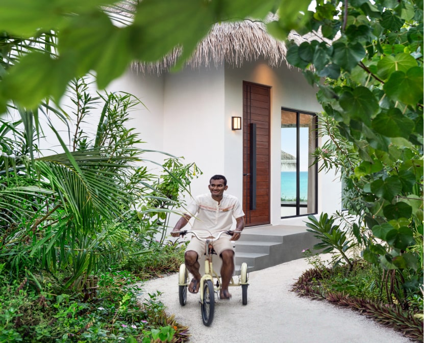 Man riding biking at a tropical destination.