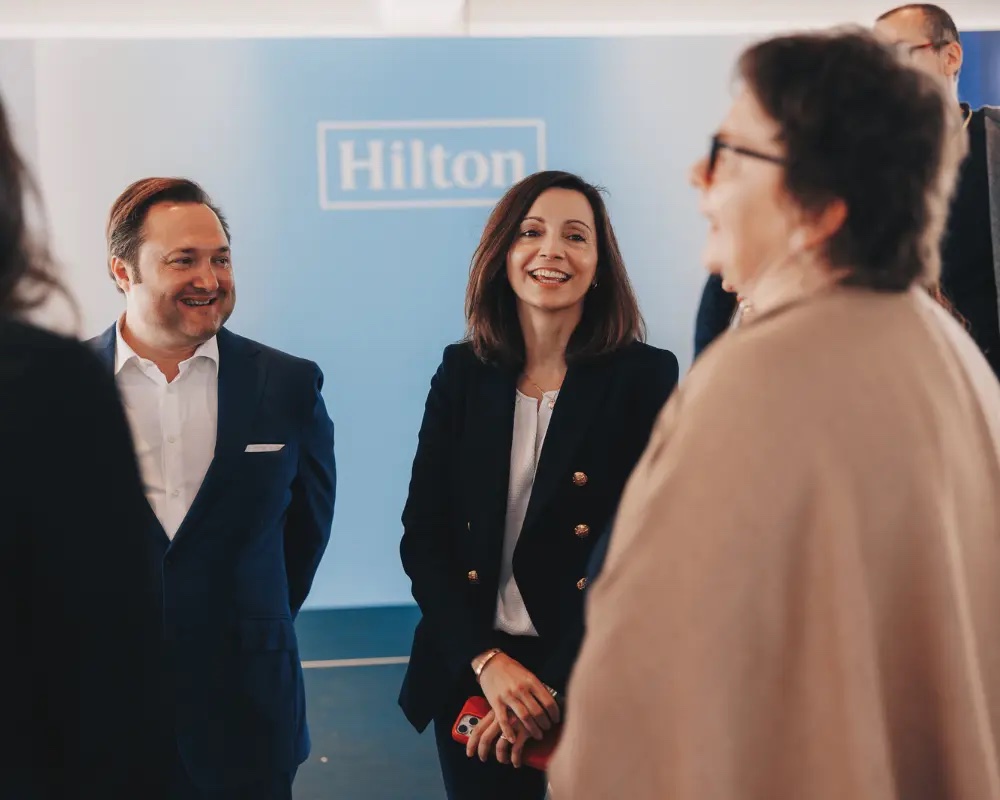 Laura Fuentes, Chief Human Resources Officer at Hilton with team members