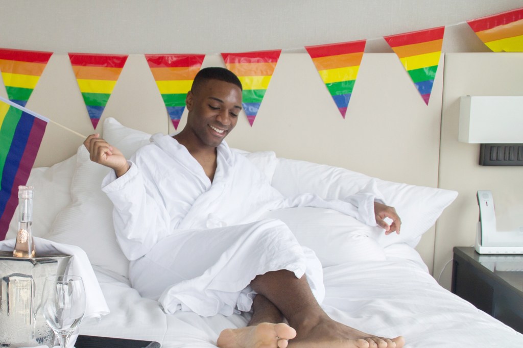 Guest in robe with Pride flag