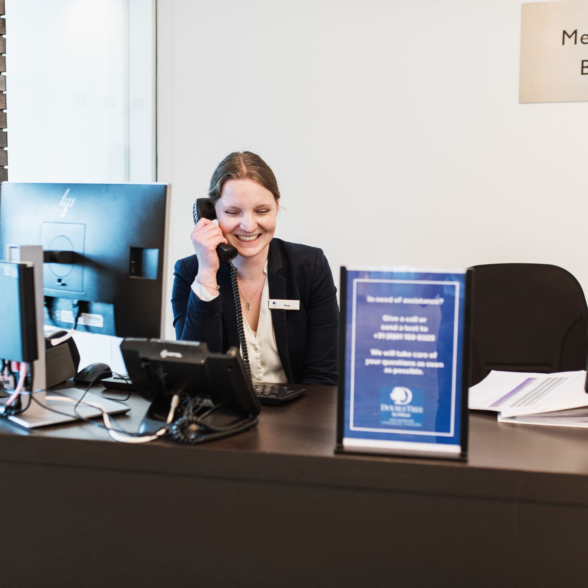 Team member answering phone at DoubleTree by Hilton Amsterdam Centraal Station - Photo Credit - ©Michelle_Piergoelam