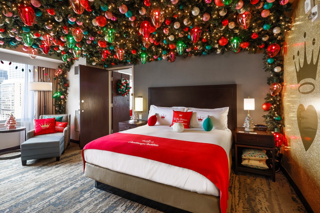 Hilton and Hallmark Channel Haul out the Holly Suite at Hilton Americas-Houston - Bed and Christmas Light Ceiling