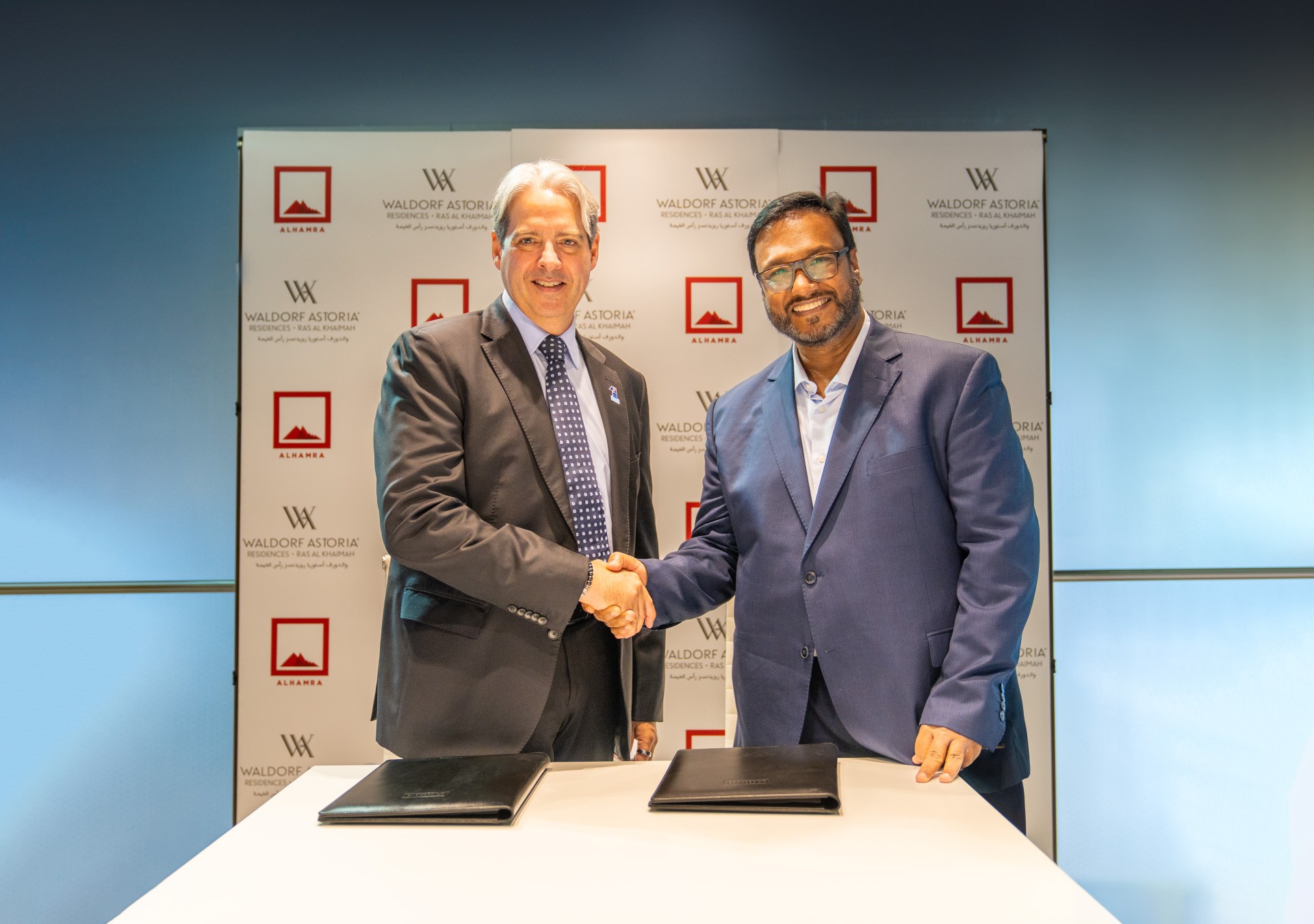 Signing of Waldorf Astoria Residences Ras Al Khaimah. (Left to right): Guy Hutchinson, president, Middle East & Africa, Hilton; Benoy Kurien, group CEO, Al Hamra.