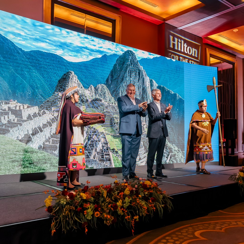 Chris Nassetta and Danny Hughes on stage at Hilton Lima Miraflores