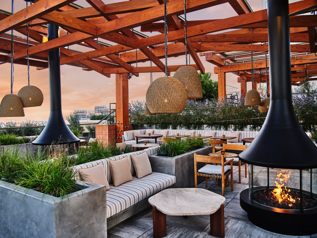 Conrad Los Angeles - Agua Viva, roof top lounge, outdoor couch seating, tables, firepit