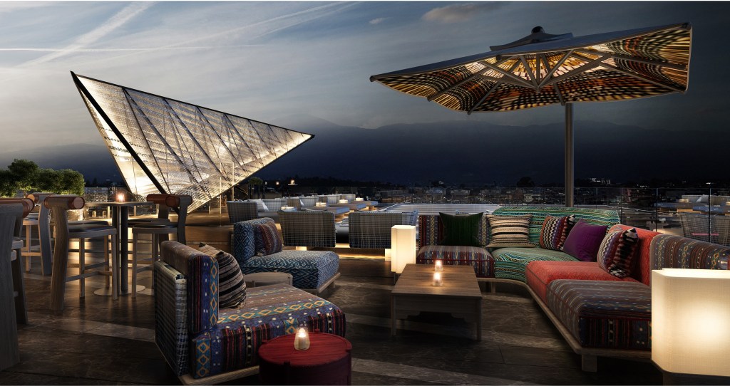 Hilton Kathmandu - Lyra Rooftop Bar, seating area, umbrella, candles, view of the mountains