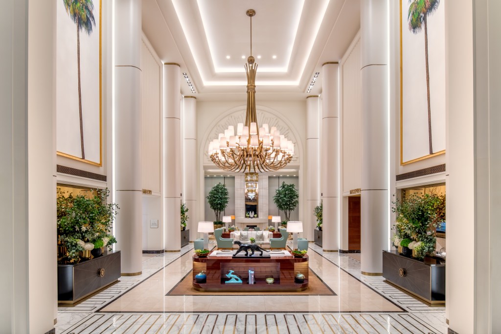 Waldorf Astoria Beverly Hills - Lobby, seating area, panther statue, chandelier, plants and assorted decor.