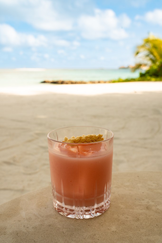 Waldorf Astoria Maldives Ithaafushi - La Guayabera Pina Colada on a beach