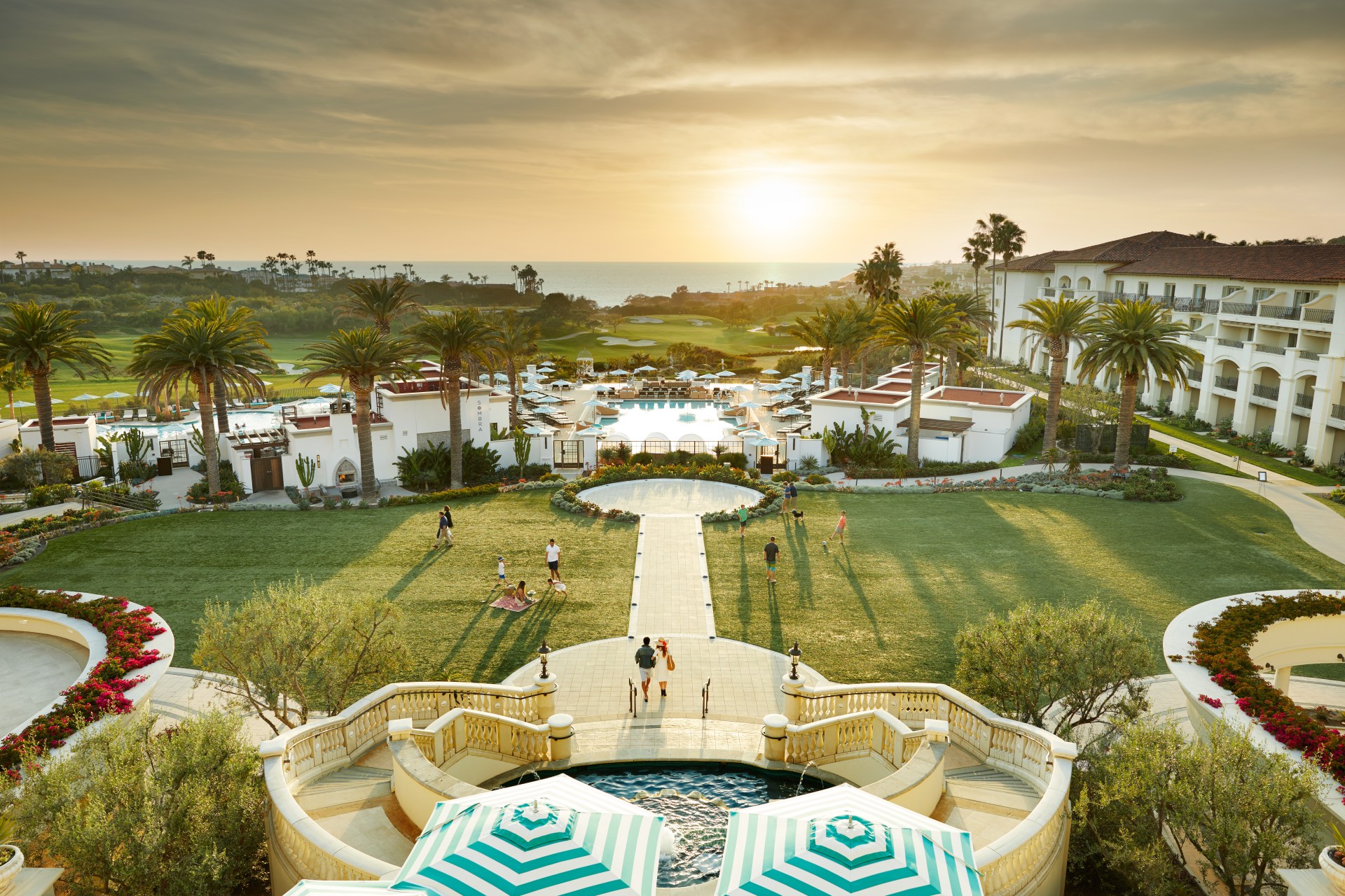 Waldorf Astoria Monarch Beach Resort & Club - Aerial, hotel exterior, landscaping, golf course, ocean view, sunset, pool, palm trees, fountain, staircases
