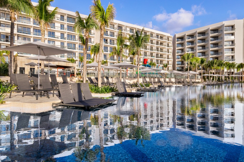 Hilton Cancun, All-Inclusive Resort, Family Pool, Lounge chairs, Palm Trees, Balcony view