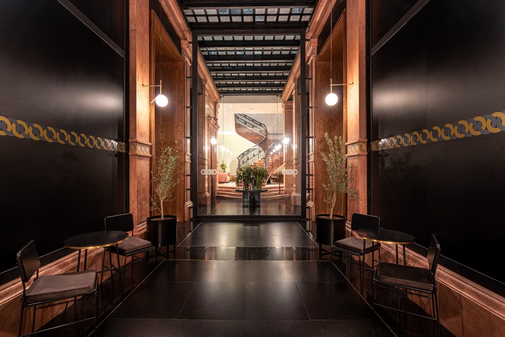 Umbral, Curio Collection by Hilton - Lobby, chairs tables, view of staircaise through glass double doors