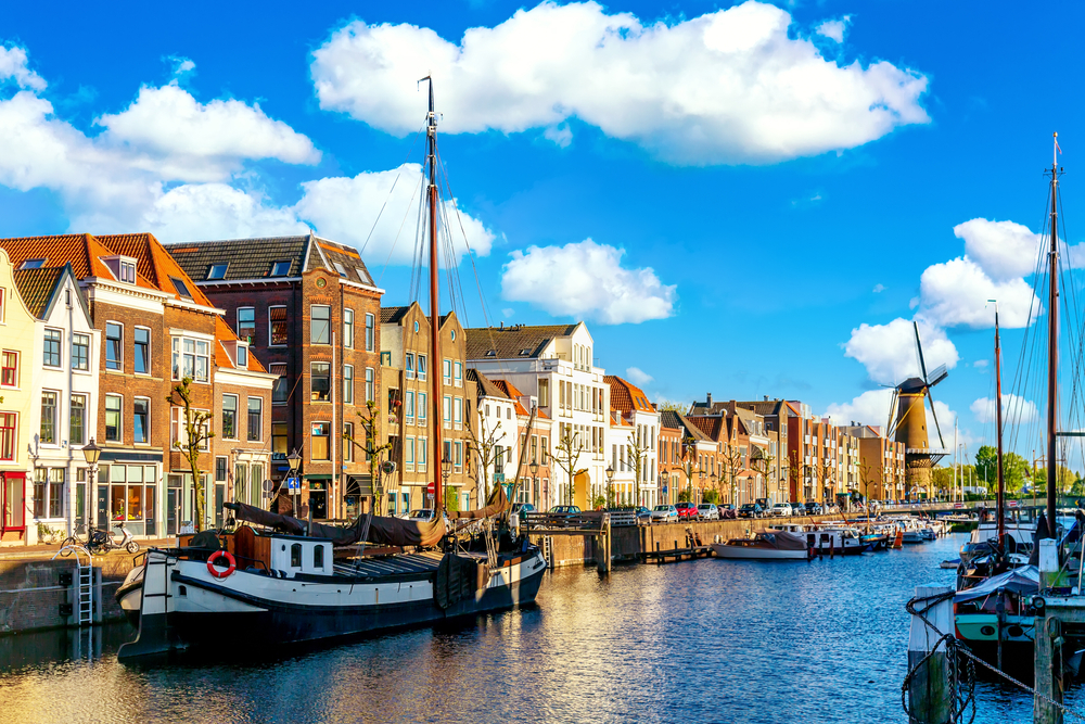 Old Historic District Delfshaven With Wildmill And Houseboats In Rotterdam