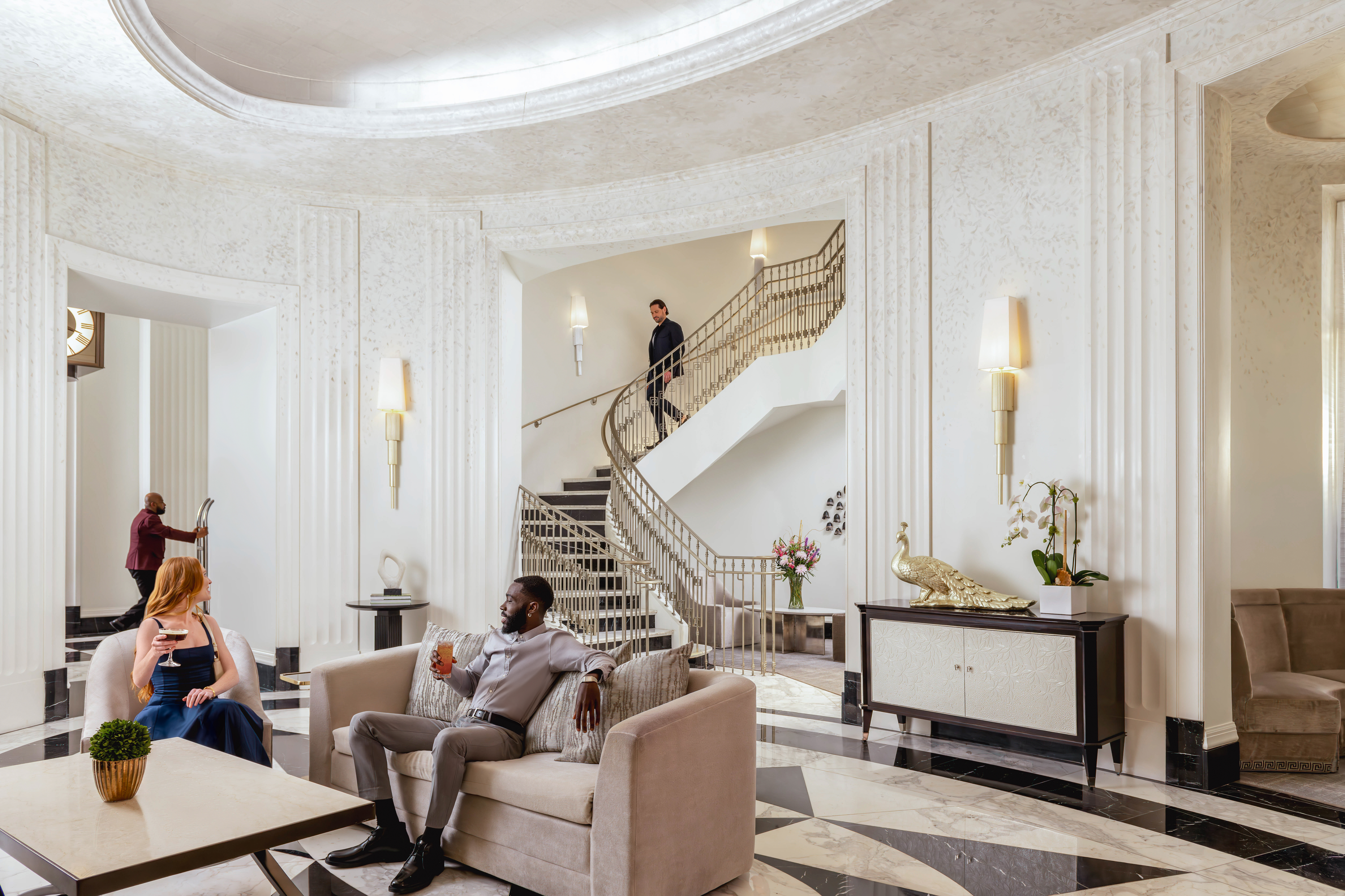 Waldorf Astoria Atlanta Buckhead Peacock Alley, grand staircase, peacock sculpture, sconce lighting, cocktail