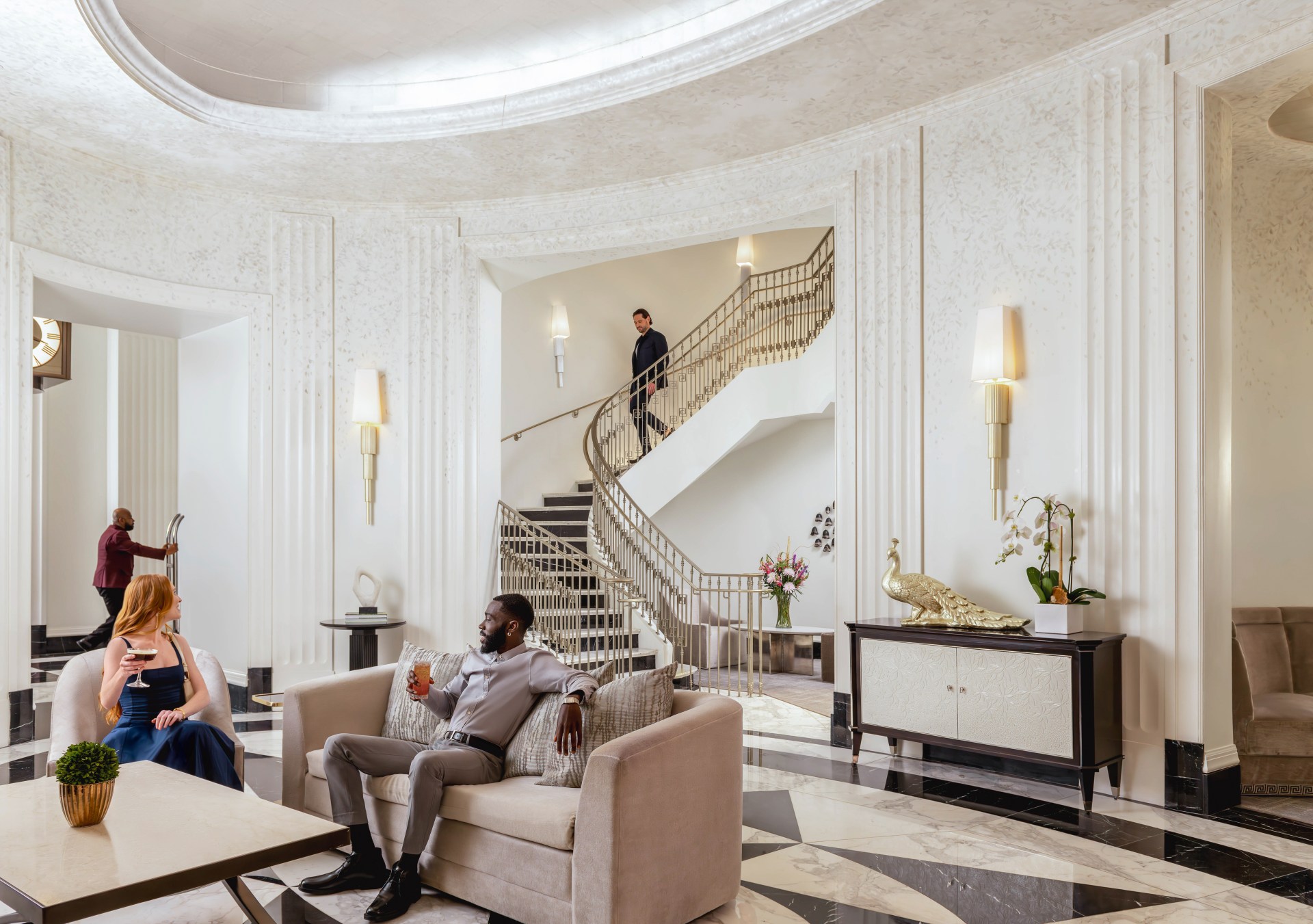 Waldorf Astoria Atlanta Buckhead Peacock Alley, grand staircase, peacock sculpture, sconce lighting, cocktail