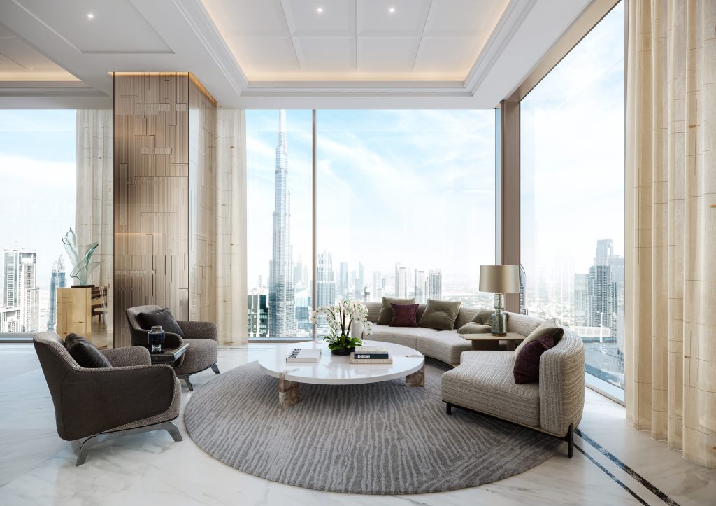 Waldorf Astoria Residences Dubai Downtown Family Room with lounge view of Downtown Dubai - sofa and two chairs around a circular table, floor to ceiling windows with views of downtown Dubai