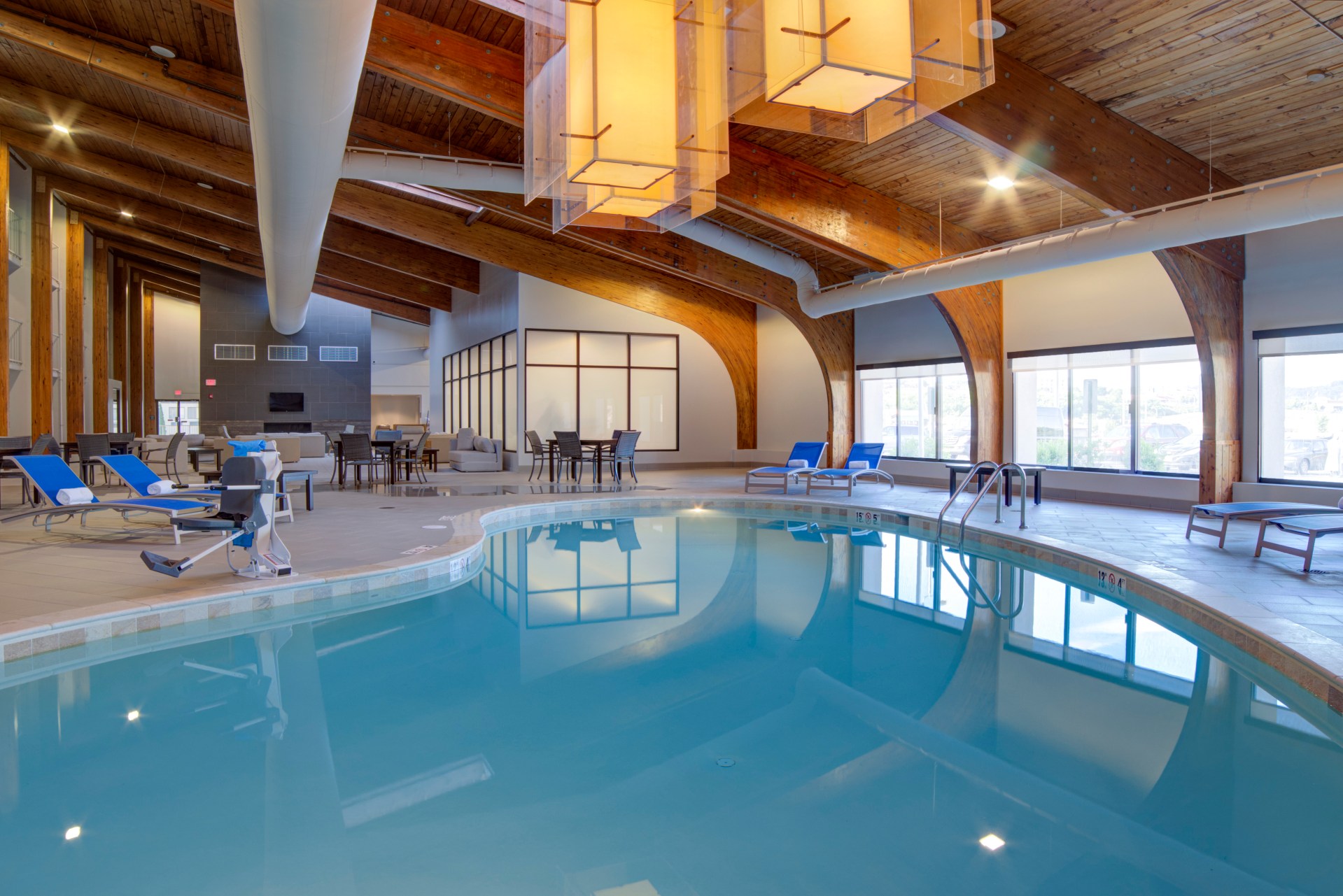 DoubleTree by Hilton Harrisonburg - Indoor Pool Atrium, pool, lounge chairs, tables