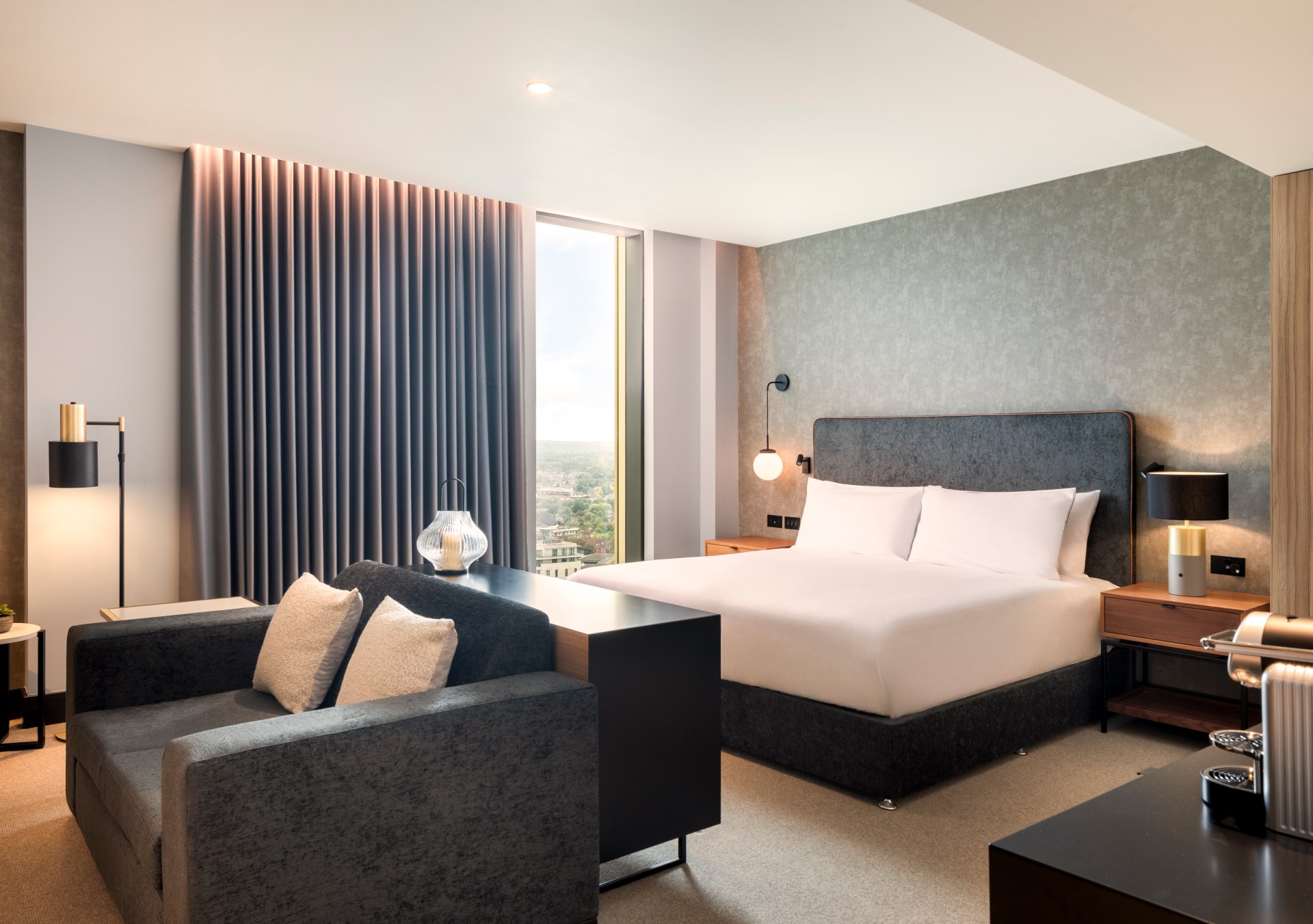 Hilton Woking - Junior Suite, bed, side tables and lamps loveseat, window with curtain