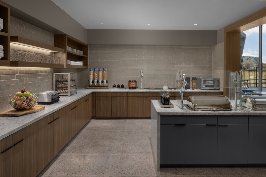 kitchen area with island and counter with various food and drink stations