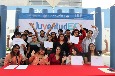 Mexico City, Mexico - International Youth Foundation - group students hold up certificates in front of banner