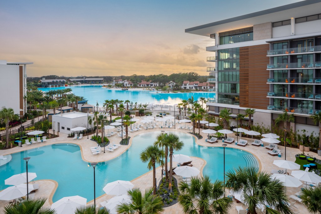 Conrad Orlando Resort, Pool, palm trees, white umbrellas, lounge seating, balcony