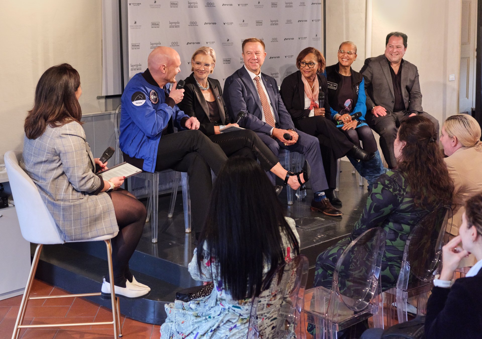 (L-R) Alexander Gerst - ESA Astronaut & Geophysicist; Emma Banks, vice president, F&B Strategy & Development, EMEA, Hilton; Tim Kopra, CEO, Starlab; ): Vanessa Wyche, director, NASA’s Johnson Space Center; Dr. Sian Proctor - Astronaut, Geoscientist & Space Artist; and Larry Traxler, senior vice president, Global Design Services, Hilton at the 75th International Aeronautical Congress in Milan, Italy. International Aeronautical Congress panel in Milan, Italy