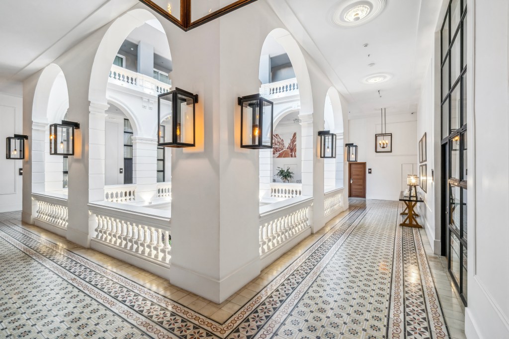 Palmaroga Hotel Asuncion, Tapestry Collection by Hilton, Corridor, Arched architecture, tiled flooring, lantern lighting, table lamp, black pendant light