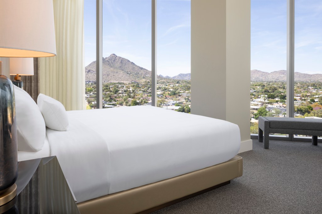 Caesar’s Republic Scottsdale, a Hilton Hotel, Mountain View Guest Room, white bedding, white curtains, bedroom with a view