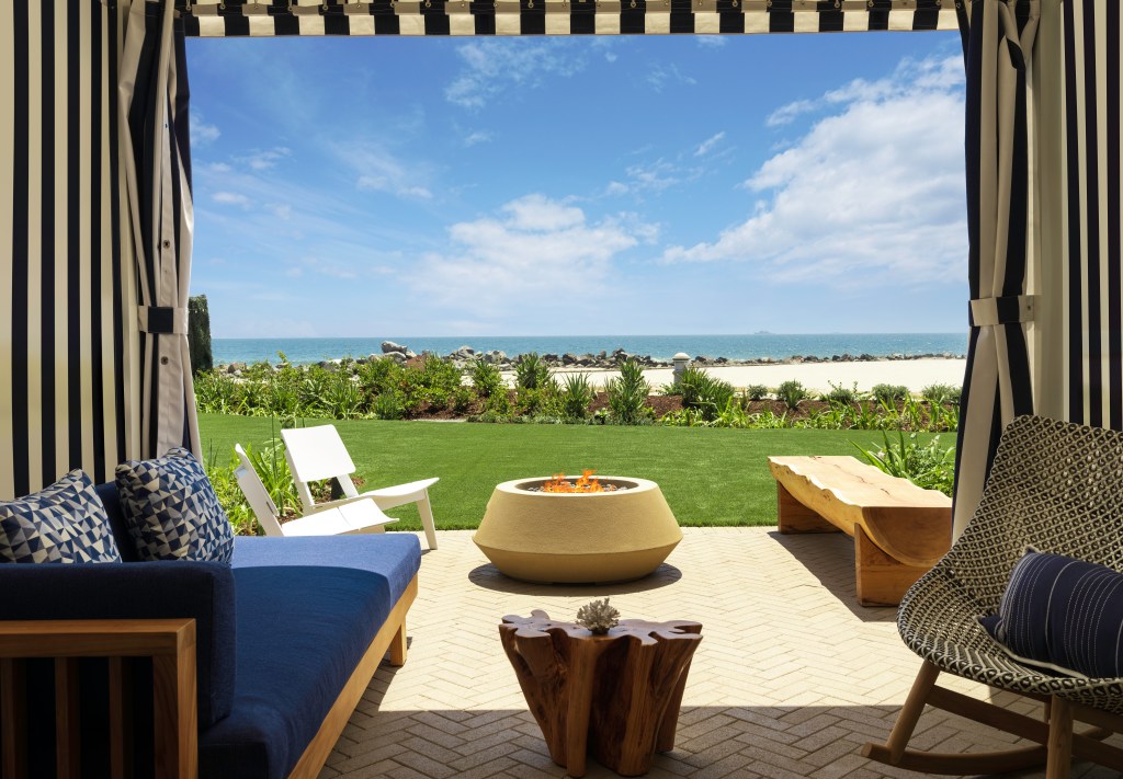 Hotel del Coronado - Cabana with lounge, chairs, bench and fire pit looking over beach and ocean