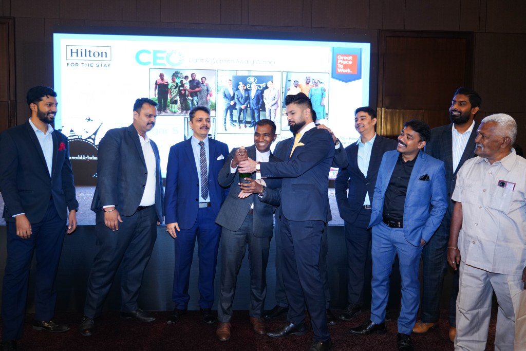 Sudhagar Sethuraman, Hilton Garden Inn Bengaluru Embassy Manyata Business Park - Hilton 2024 CEO Light &amp; Warmth Award Winner, Sudhagar on stage with team