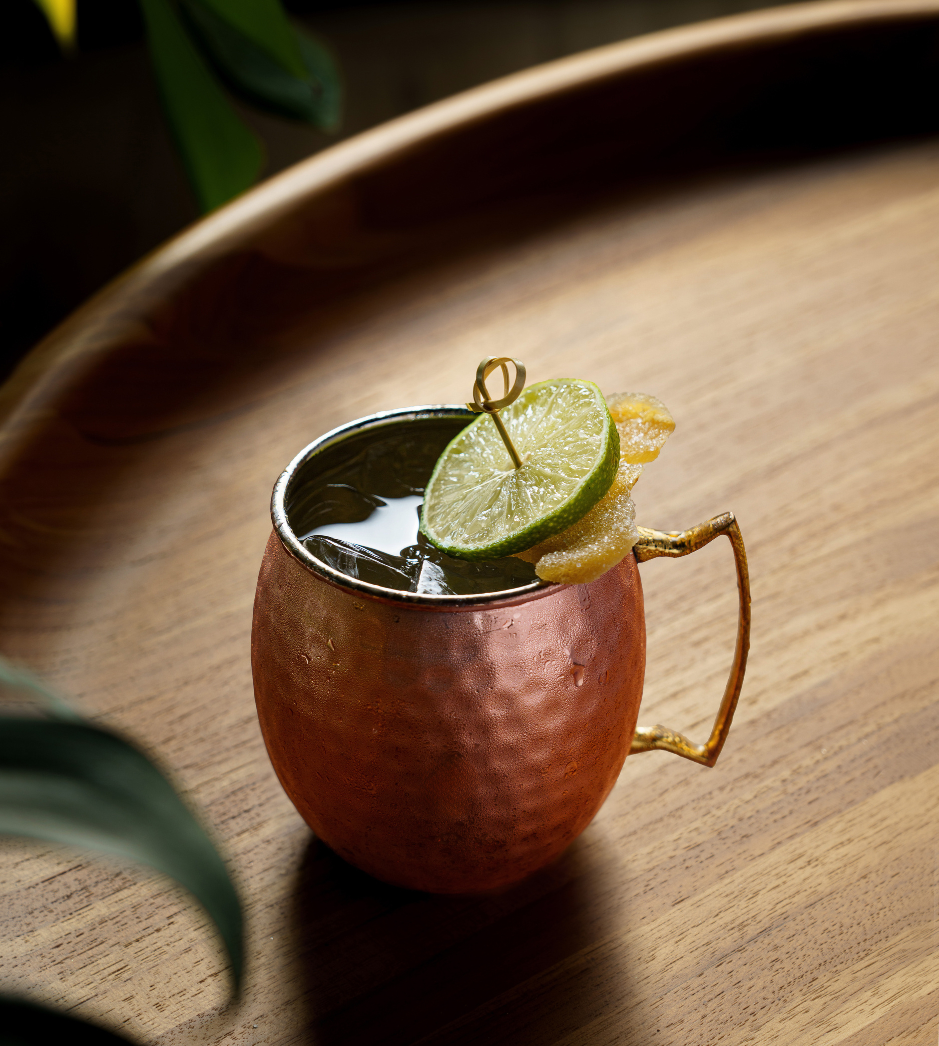 Graduate by Hilton, Bracket Buster Mule, lime garnish, candied garnish, cocktail, copper mule glass, iced beverage