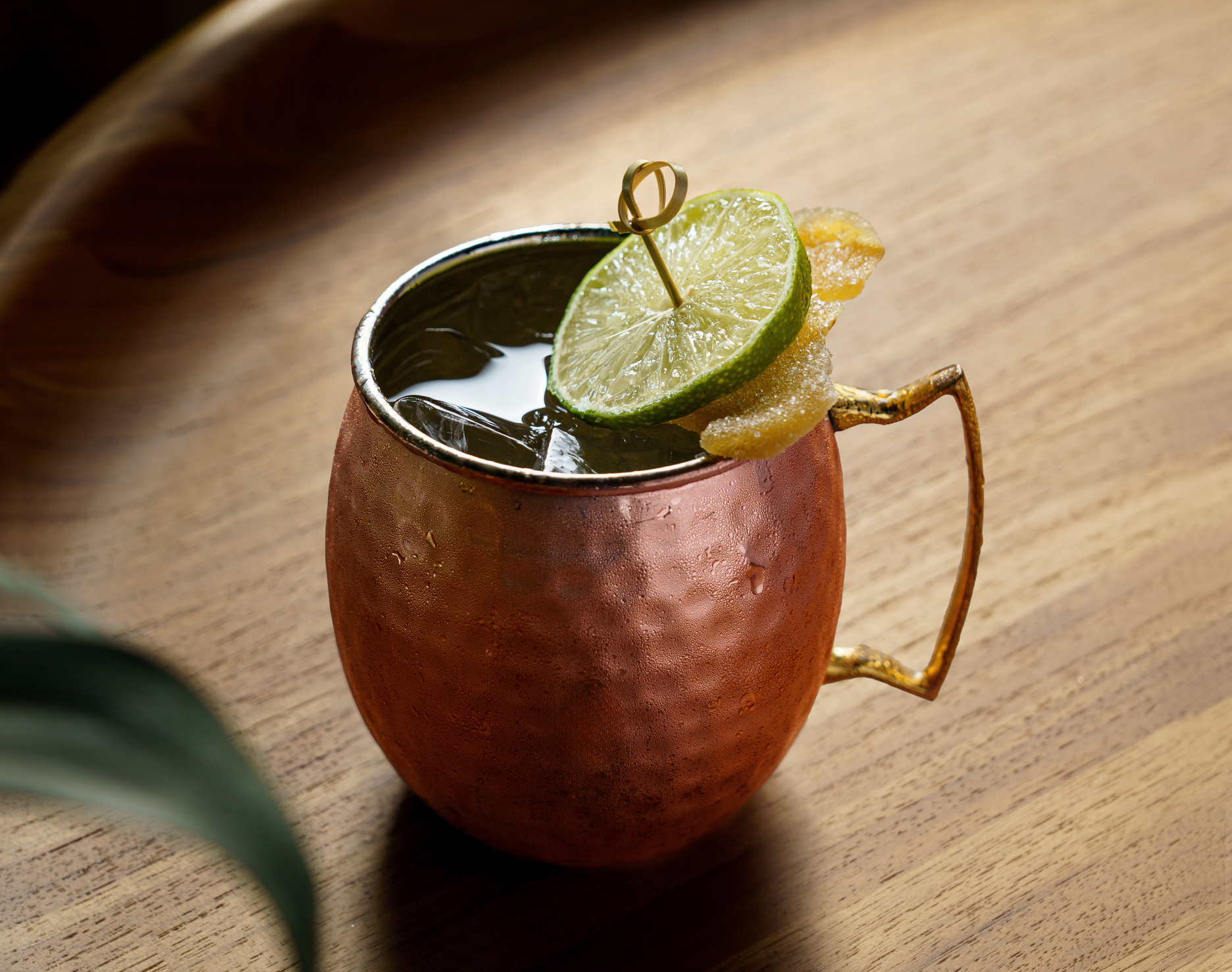 Graduate by Hilton, Bracket Buster Mule, lime garnish, candied garnish, cocktail, copper mule glass, iced beverage