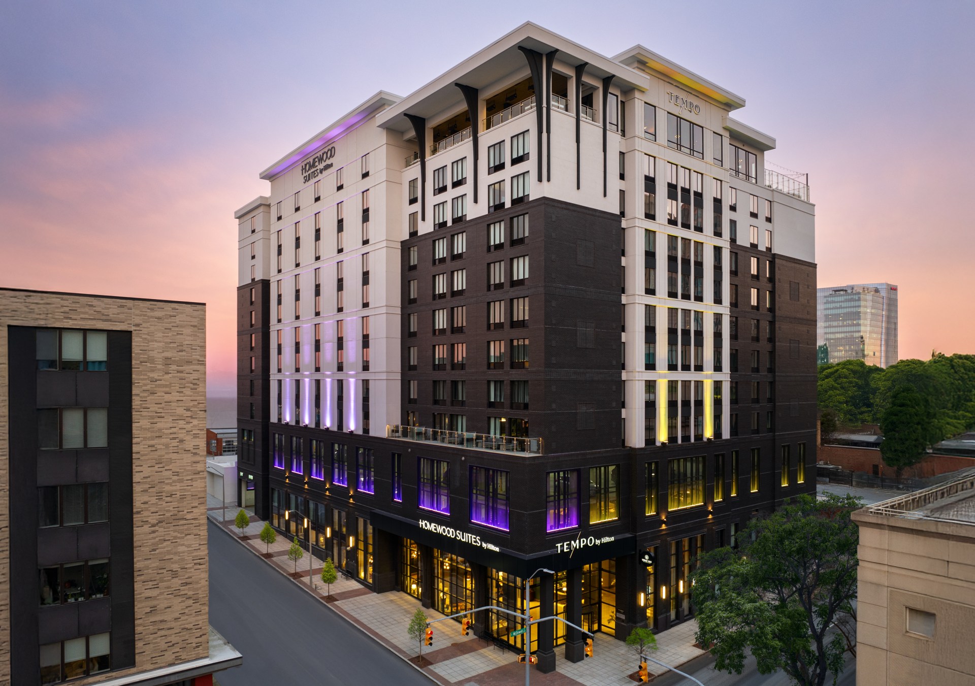exterior photo of Tempo by Hilton Raleigh Downtown X Homewood Suites by Hilton Raleigh Downtown at sunrise