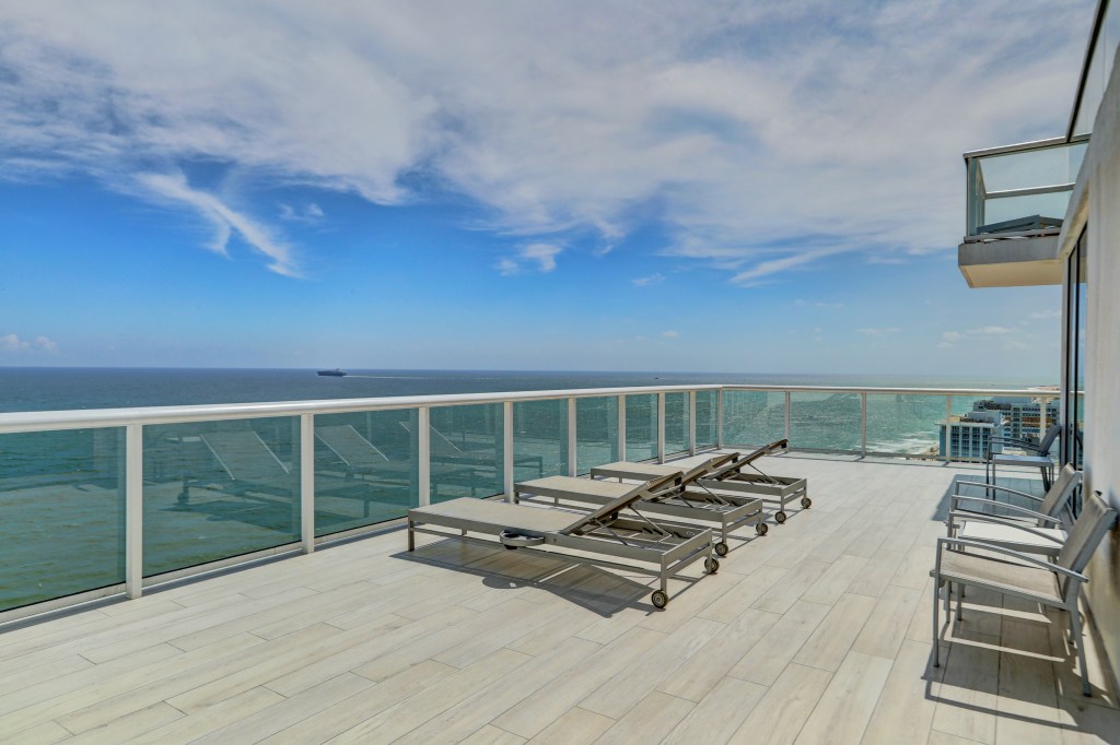 Beach House Fort Lauderdale, a Hilton Resort - Oceanfront Two Bedroom Suite - Private Deck, deck overlooking the ocean with lounge chairs