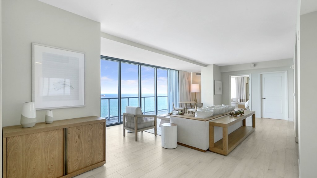 Beach House Fort Lauderdale, a Hilton Resort - Penthouse Living Room, couches, coffee table and chair looking out at the ocean