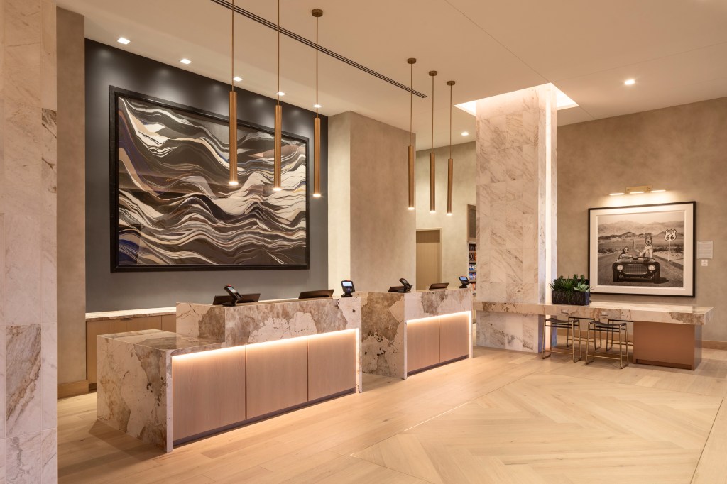 Caesar's Republic Scottsdale, a Hilton Hotel - lobby with marble front desksand decorative paintings