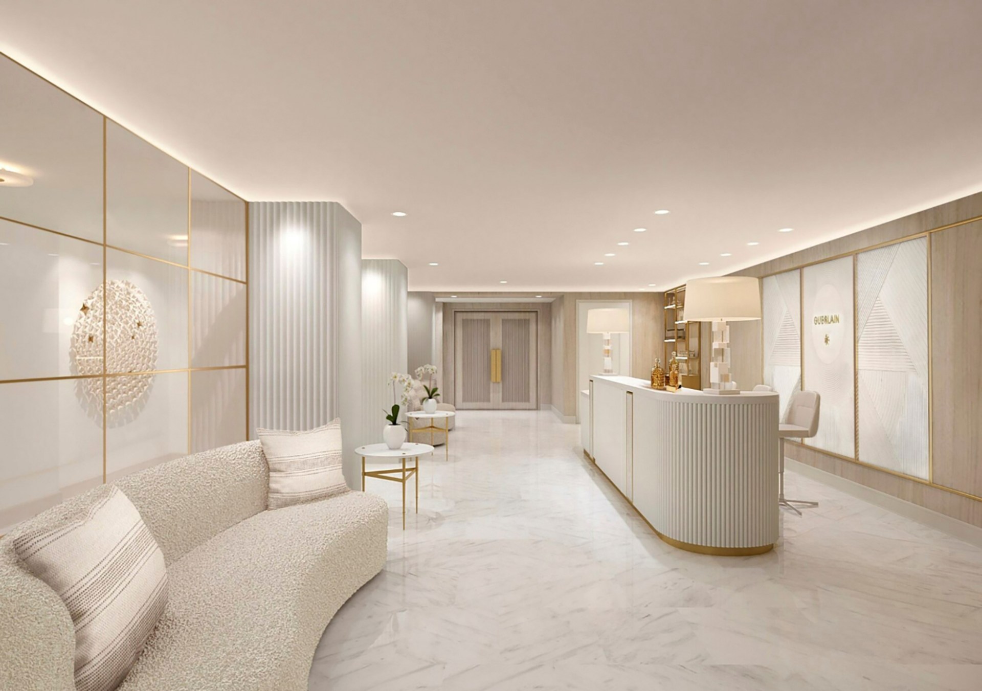 Guerlain Wellness Spa at Waldorf Astoria New York Reception area - Wimberly Interiors, reception desk, white floor, cream walls, plush cream sofa seating area, gold and white tables, gold shelving and accents