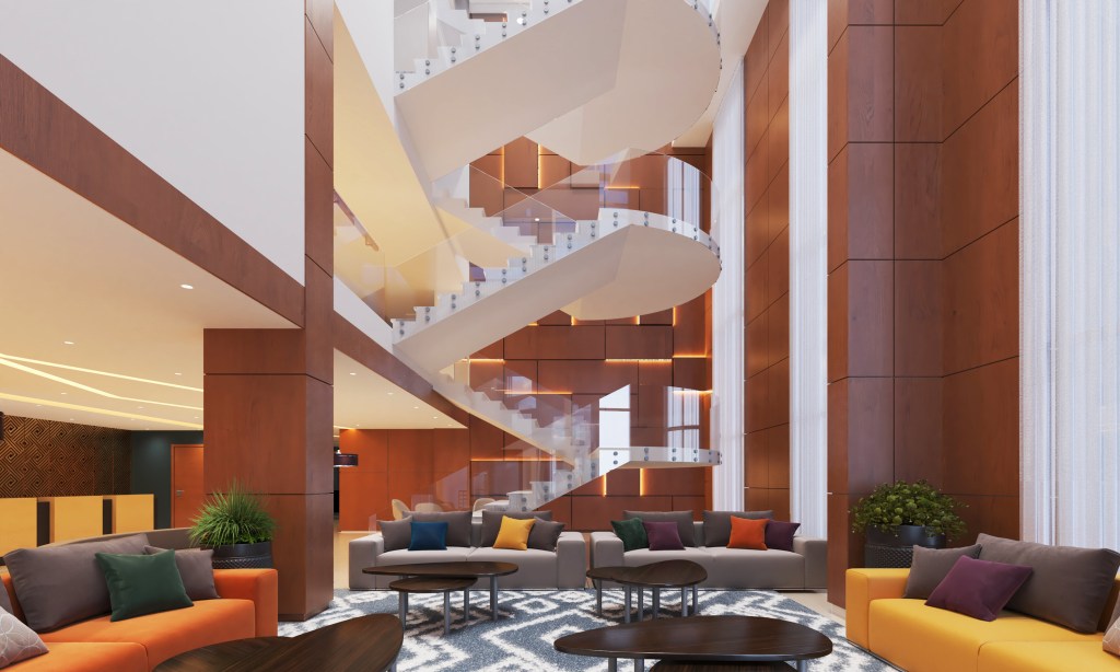 DoubleTree by Hilton Addis Ababa Airport Lobby, colorful couch sitting area, lobby staircase, nesting coffee tables, potted plants