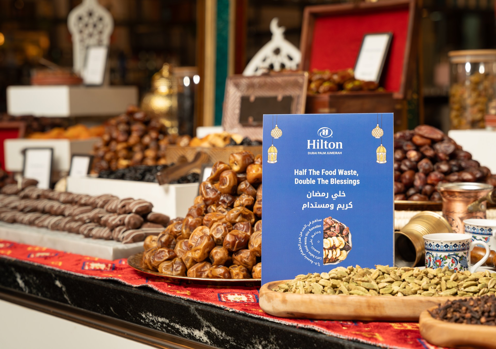 Dessert buffet with Hilton Green Ramadan 2025 signage