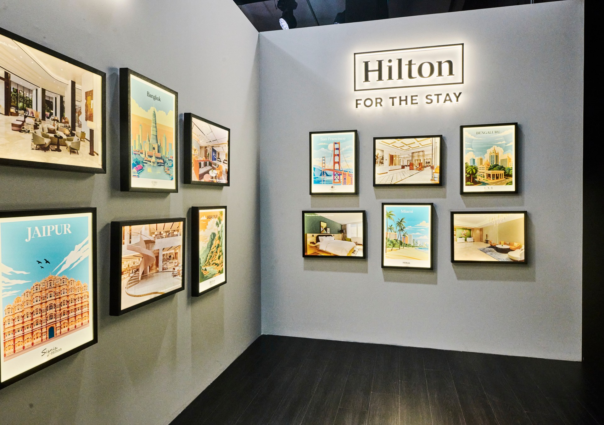 Hilton's Brand Showcase in India - New Arrivals artwork featuring posters of cities around the world and Hilton photos