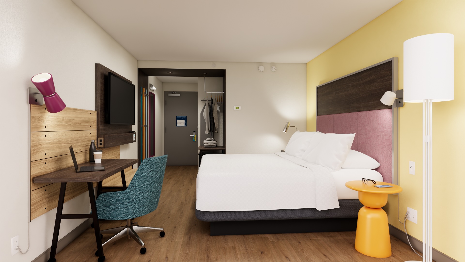 Tru by Hilton, Guest Room, Bed with yellow side table and sconce lighting, desk with chair