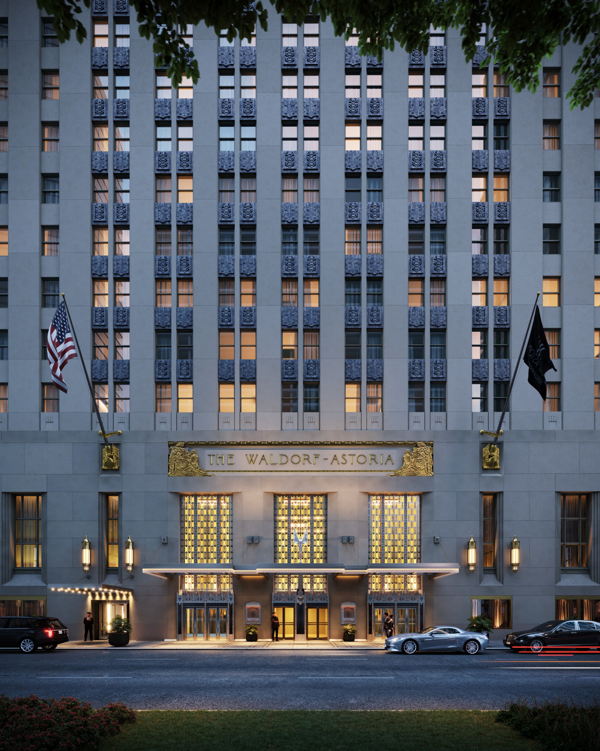 Waldorf Astoria New York – Park Avenue Entrance at night with cars pulling up and team members outside